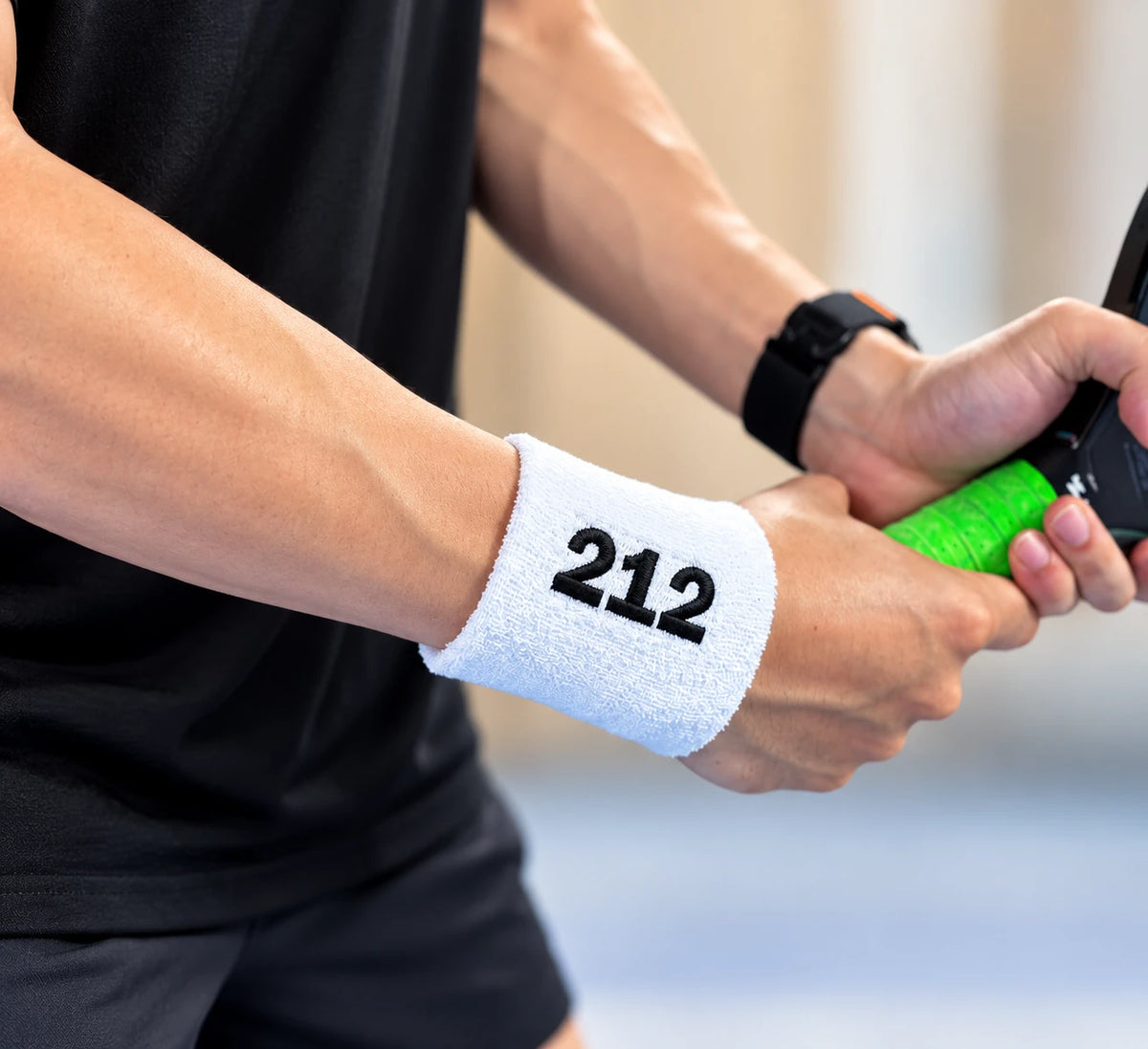 Whte 212 wristband in black text
